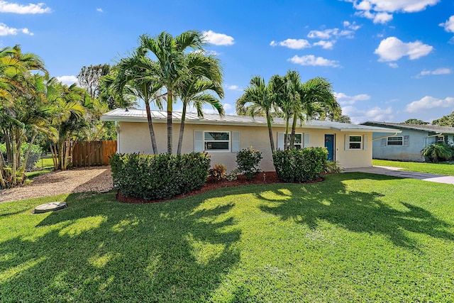 ranch-style house with a front lawn