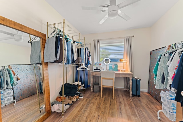 spacious closet featuring hardwood / wood-style floors and ceiling fan