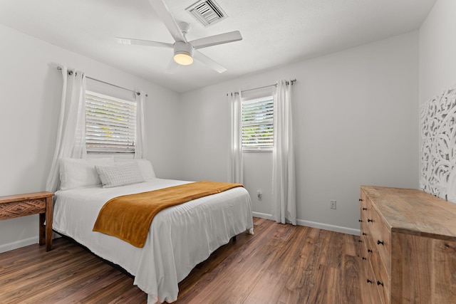 bedroom featuring dark wood-type flooring and ceiling fan