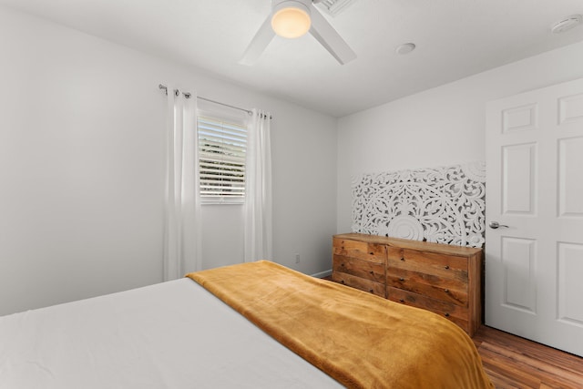 bedroom featuring wood-type flooring and ceiling fan