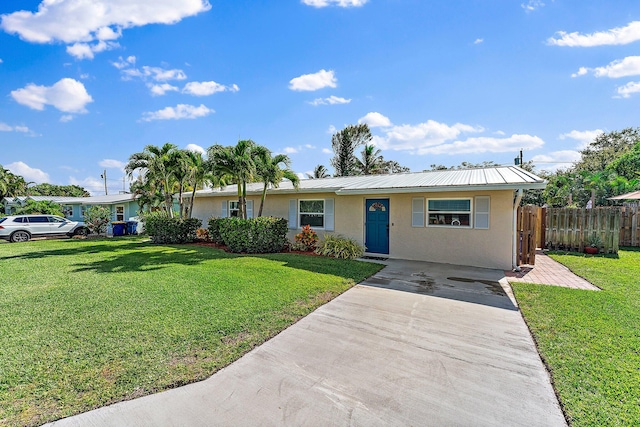 single story home featuring a front yard