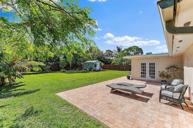 view of patio / terrace featuring french doors and a shed