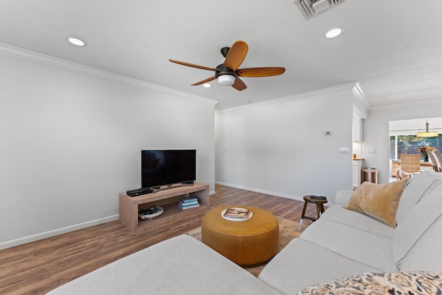 living room with ceiling fan, wood-type flooring, and crown molding