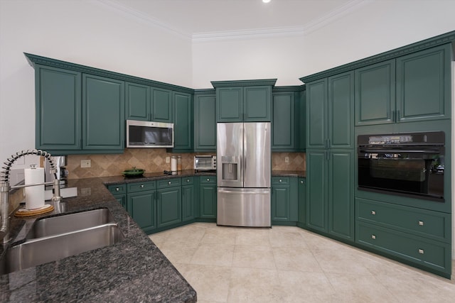 kitchen with light tile patterned flooring, decorative backsplash, crown molding, sink, and stainless steel appliances