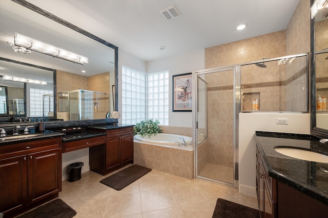 bathroom with vanity, shower with separate bathtub, and tile patterned flooring