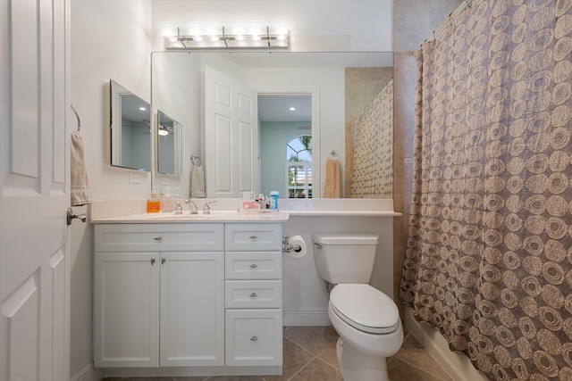 bathroom featuring a shower with curtain, vanity, tile patterned flooring, and toilet