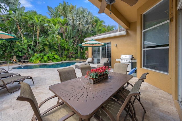 view of patio with a grill and ceiling fan