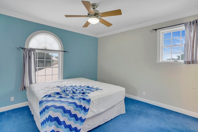 bedroom with ceiling fan, crown molding, and dark carpet