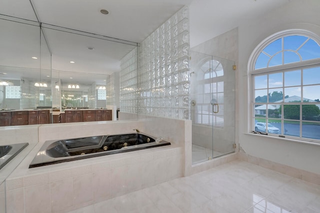 bathroom featuring independent shower and bath and vanity