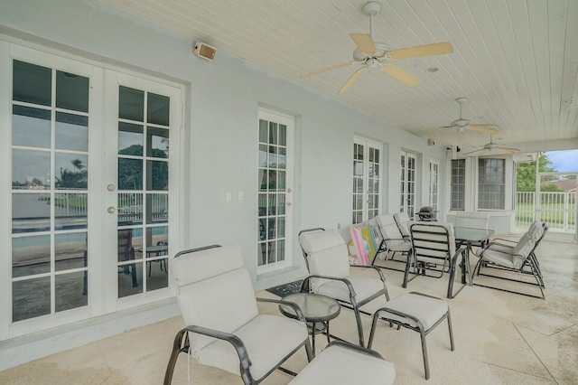 exterior space featuring ceiling fan and french doors