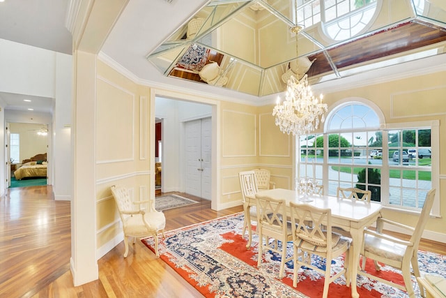 living room with ornamental molding, light hardwood / wood-style floors, and a textured ceiling