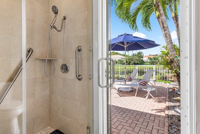 bathroom with a shower with shower door