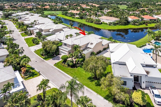 birds eye view of property with a water view