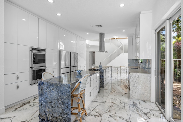 kitchen featuring appliances with stainless steel finishes and white cabinets