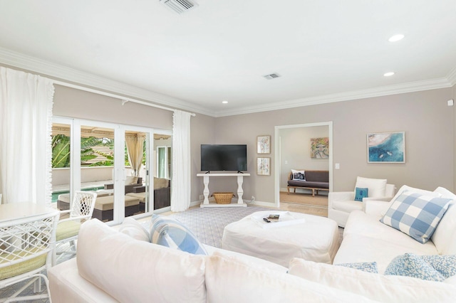 carpeted living room featuring ornamental molding and french doors