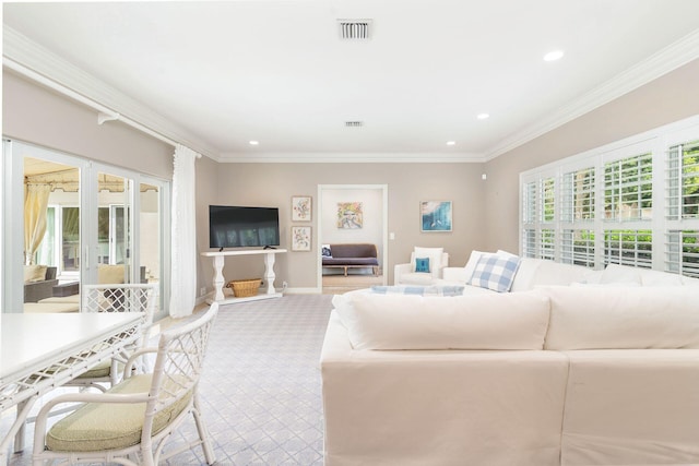 living room featuring crown molding