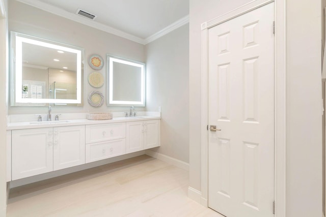 bathroom featuring ornamental molding, a shower with door, hardwood / wood-style floors, and vanity