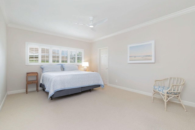 bedroom with ornamental molding, carpet, and ceiling fan