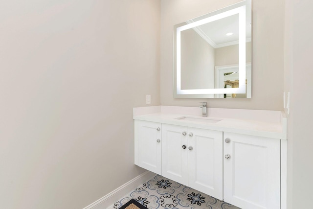 bathroom with crown molding, vanity, and tile patterned flooring