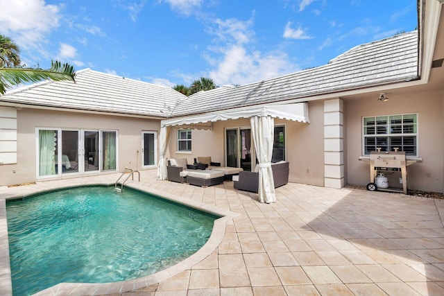 view of swimming pool with french doors, an outdoor hangout area, and a patio area