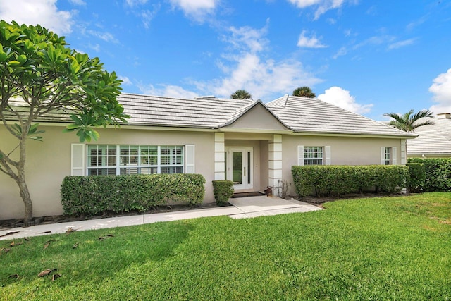 single story home with a front yard