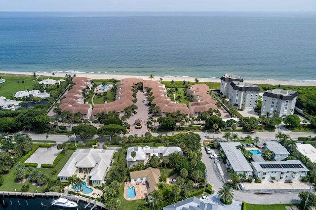 bird's eye view featuring a water view and a view of the beach