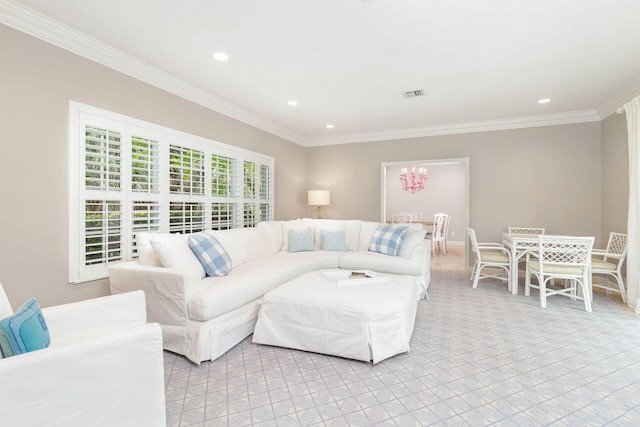 living room featuring ornamental molding and a chandelier