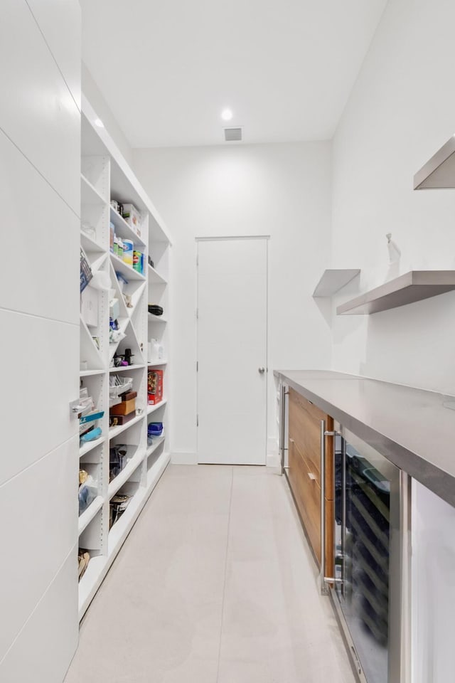 pantry featuring beverage cooler