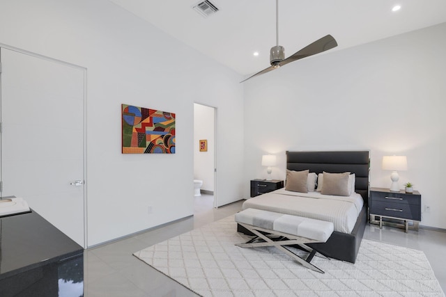 bedroom with ceiling fan and connected bathroom