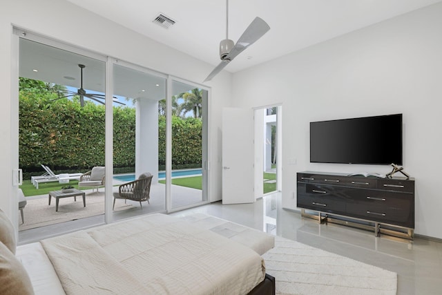 bedroom with ceiling fan and access to outside