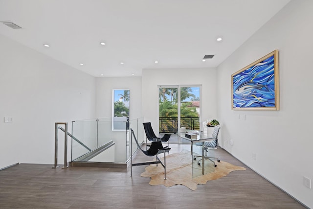 living area with dark hardwood / wood-style floors