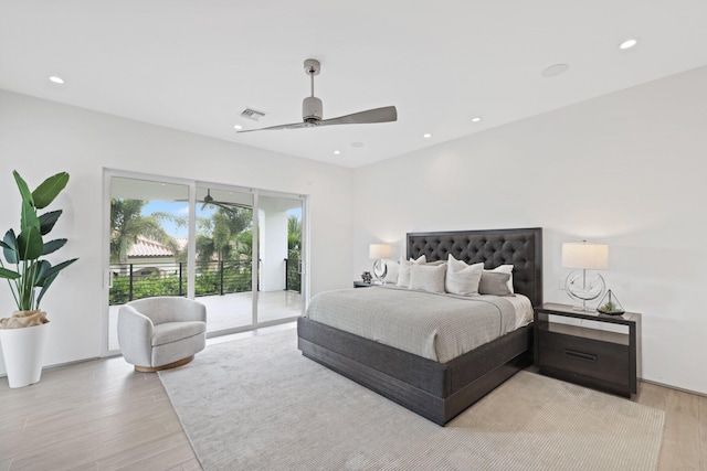 bedroom featuring ceiling fan, light hardwood / wood-style floors, and access to outside