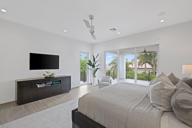 bedroom featuring access to outside, light hardwood / wood-style flooring, and ceiling fan