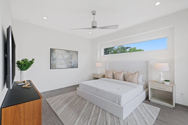 bedroom featuring ceiling fan and dark hardwood / wood-style floors