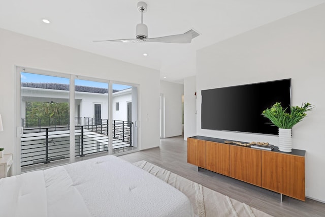 bedroom with ceiling fan, access to outside, and light hardwood / wood-style flooring