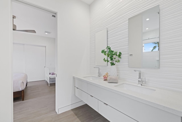 bathroom with hardwood / wood-style floors and vanity