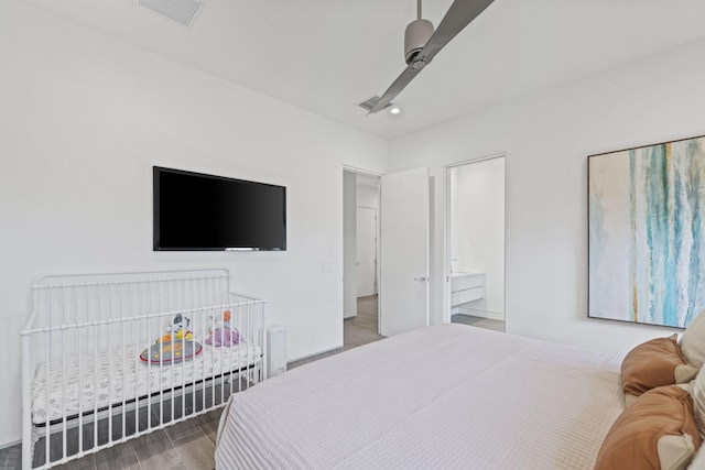 bedroom featuring hardwood / wood-style flooring and ceiling fan