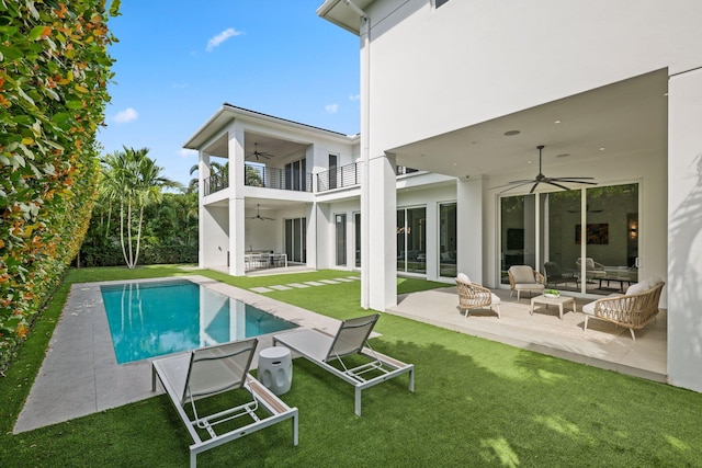 rear view of house with an outdoor hangout area, ceiling fan, a patio, and a balcony