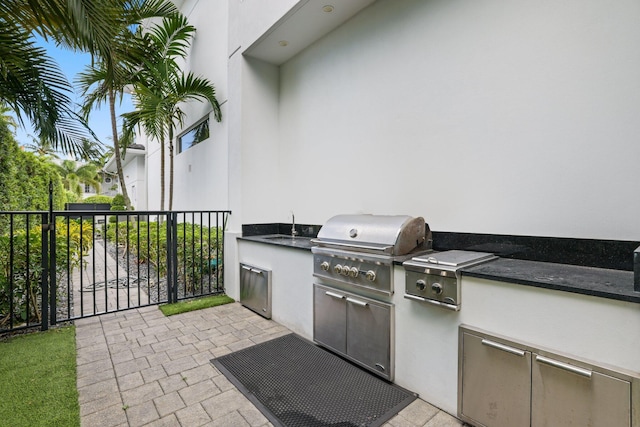 view of patio featuring exterior kitchen