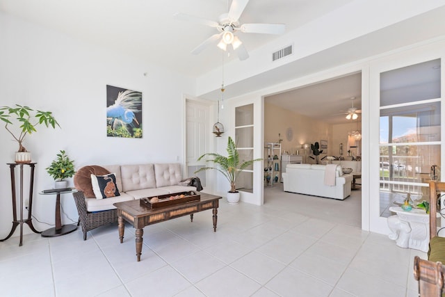 tiled living room featuring ceiling fan