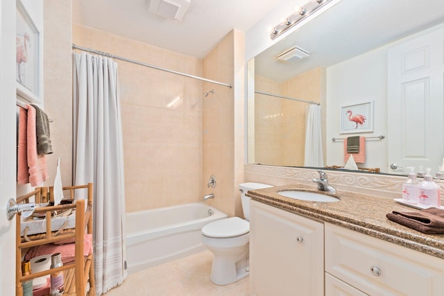 full bathroom featuring vanity, tile patterned flooring, toilet, a textured ceiling, and shower / tub combo