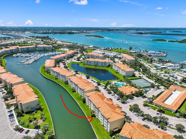 birds eye view of property featuring a water view