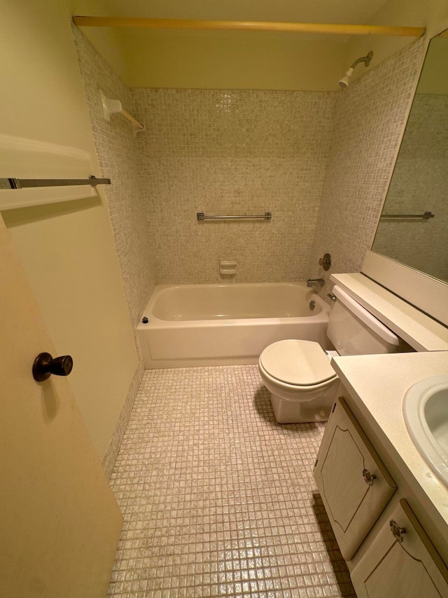 full bathroom with bathtub / shower combination, vanity, toilet, and tile patterned flooring