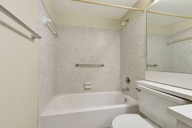 bathroom with toilet and  shower combination