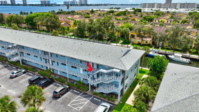 birds eye view of property with a water view