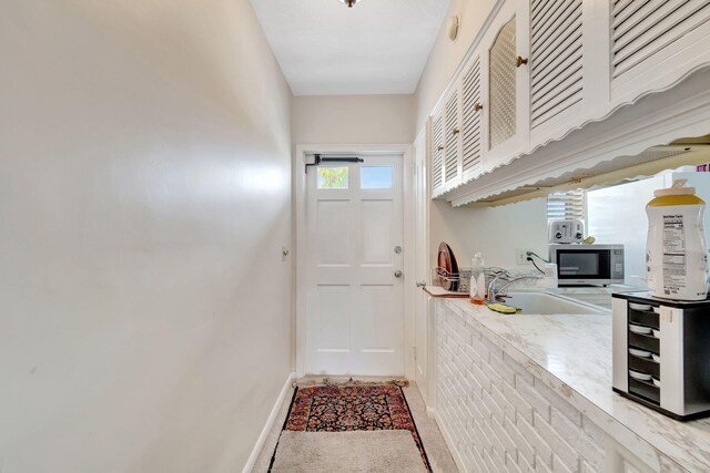 doorway featuring sink