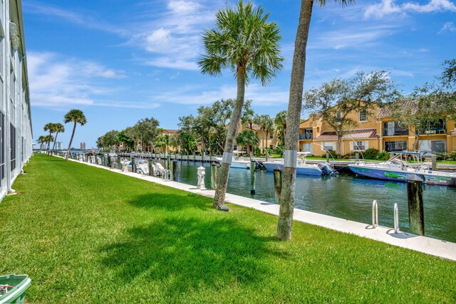 exterior space featuring a boat dock and a water view