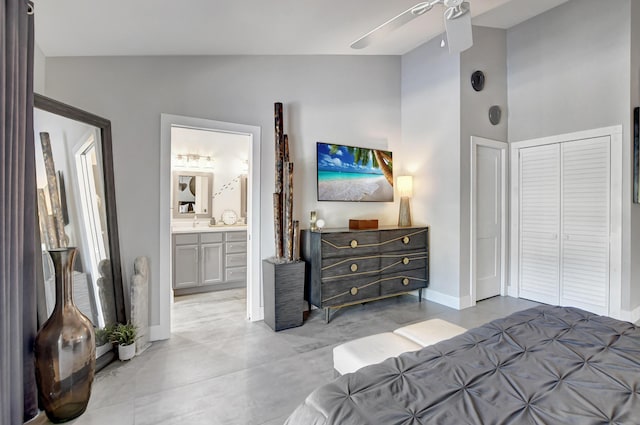 2951 San Remo Way, Delray Beach, FL 33445 - bedroom featuring high vaulted ceiling, baseboards, connected bathroom, a ceiling fan, and a closet