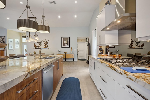 kitchen with visible vents, wall chimney range hood, dishwasher, modern cabinets, and a sink