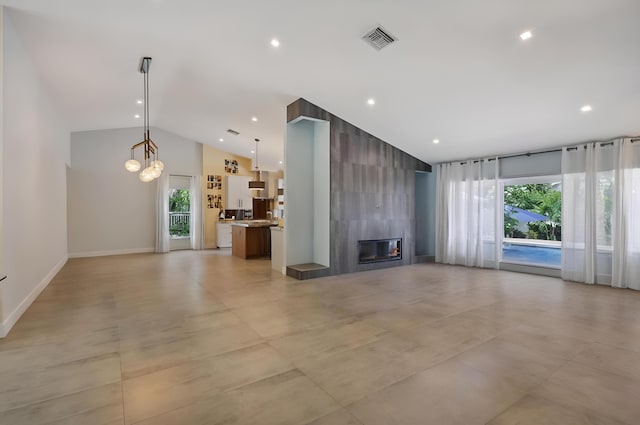 2951 San Remo Way, Delray Beach, FL 33445 - unfurnished living room featuring a fireplace, recessed lighting, baseboards, a chandelier, and high vaulted ceiling